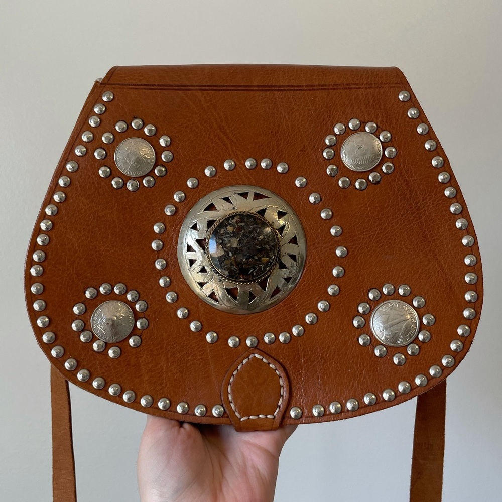 • Italian leather studded satchel with silver detailing •